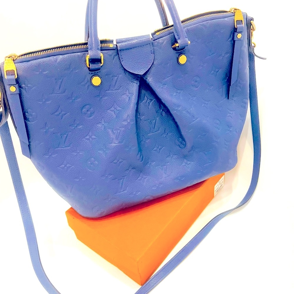 Louis Vuitton bag and wallet in a gorgeous blue color.